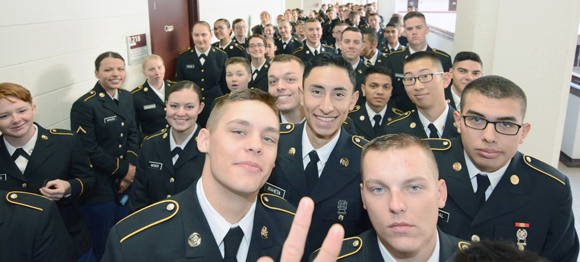 Soldiers from the Army Medical Department Center & School at Joint Base San Antonio-Fort Sam Houston wait to be picked up by families from San Antonio and surrounding cities for Mission Thanksgiving Nov. 23.