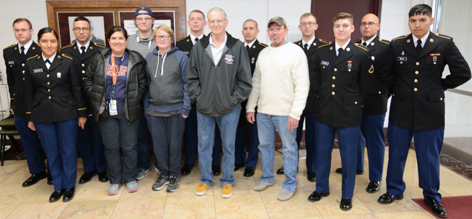 Dennis Reilly (center) with his family and nine Soldiers. This marks the 16th year Reilly and his family have hosted Soldiers for Mission Thanksgiving.