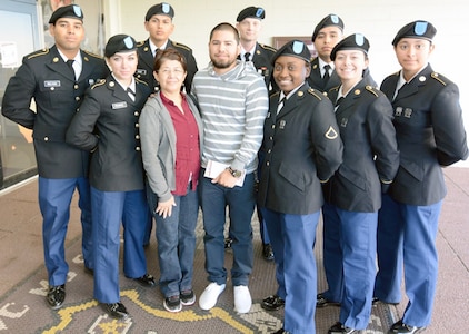 Cynthia Caballero and Josh Gutierrez with eight Soldiers from the Army Medical Department Center & School at Joint Base San Antonio-Fort Sam Houston Nov. 23 they hosted for Mission Thanksgiving,
