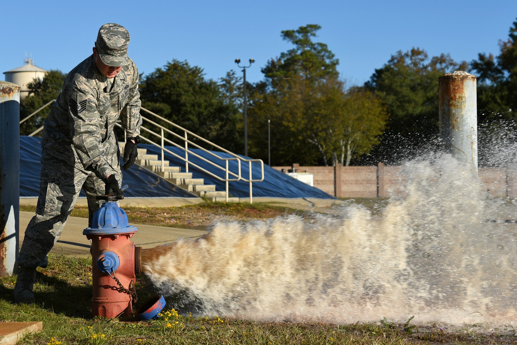 U.S. Air Force Tech. Sgt. Larry Diaz, 20th Civil Engineer Squadron noncommissioned officer in charge of training, opens a fire hydrant at Shaw Air Force Base, South Carolina, Nov. 17, 2017.