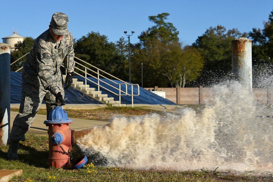U.S. Air Force Tech. Sgt. Larry Diaz, 20th Civil Engineer Squadron noncommissioned officer in charge of training, opens a fire hydrant at Shaw Air Force Base, South Carolina, Nov. 17, 2017.