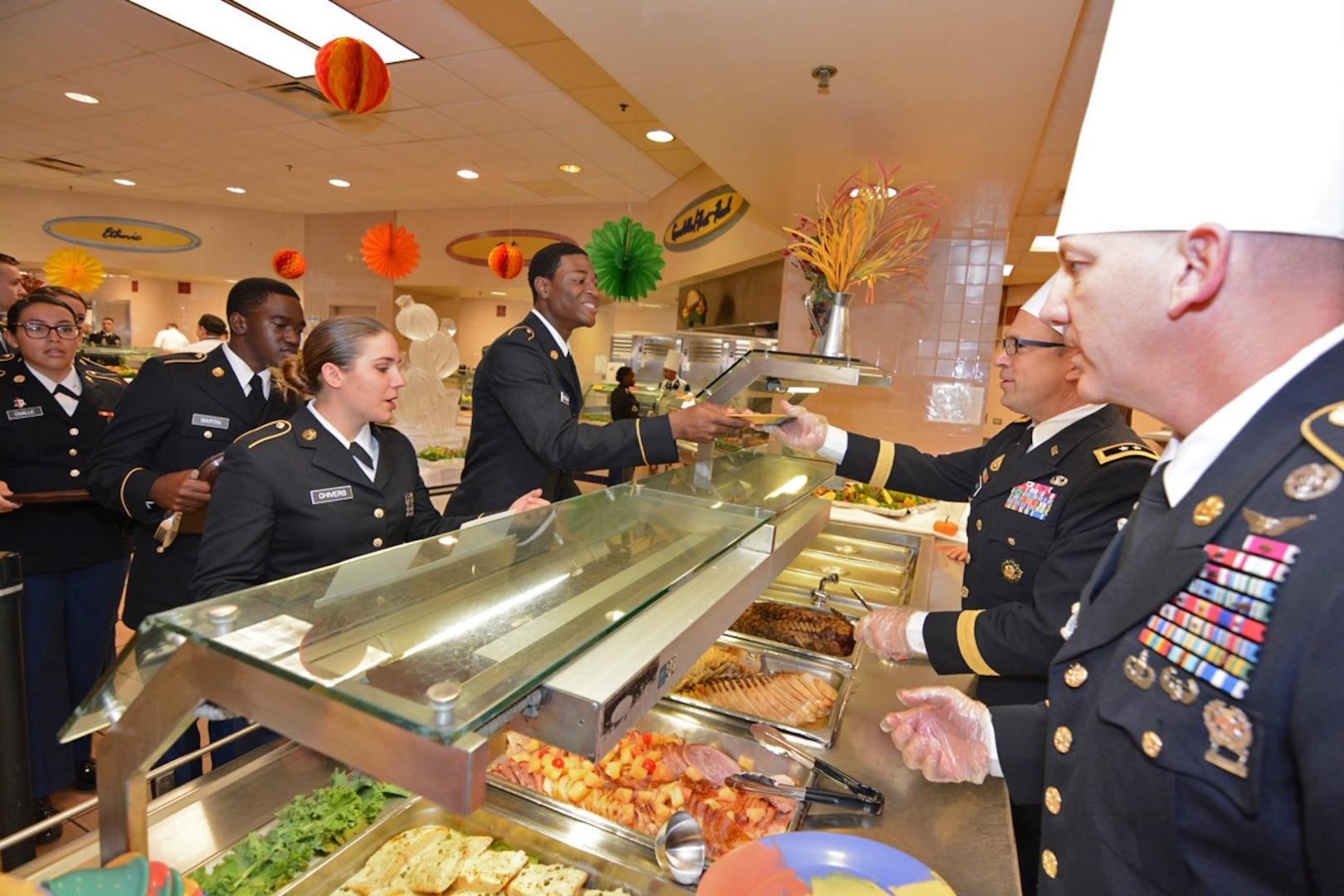 Maj. Gen. Brian C. Lein, Commanding General, Army Medical Department Center & School at Joint Base San Antonio-Fort Sam Houston, AMEDDC&S Command Sgt. Maj. Buck O'Neal and other leaders serve Thanksgiving dinner to Soldiers at the Rocco Dining Facility at JBSA-Fort Sam Houston Nov. 23.