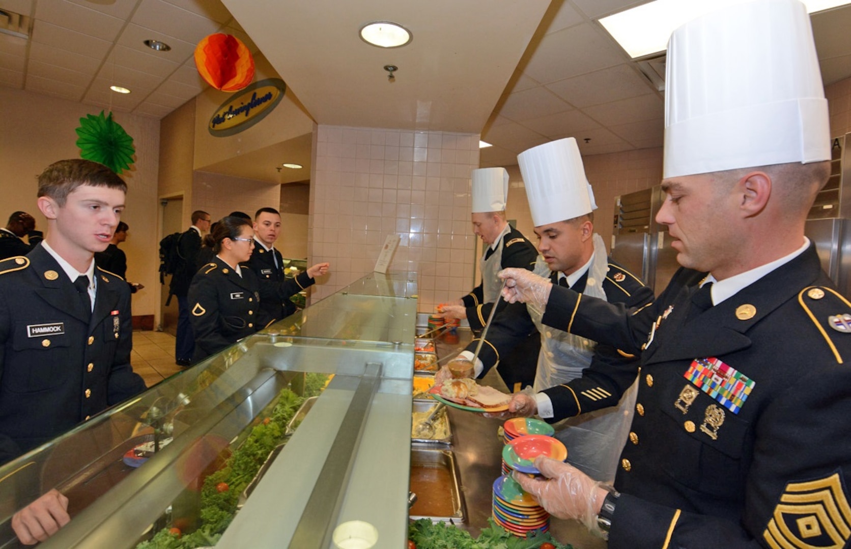 Maj. Gen. Brian C. Lein, Commanding General, Army Medical Department Center & School at Joint Base San Antonio-Fort Sam Houston, AMEDDC&S Command Sgt. Maj. Buck O'Neal and other leaders serve Thanksgiving dinner to Soldiers at the Rocco Dining Facility at JBSA-Fort Sam Houston Nov. 23.