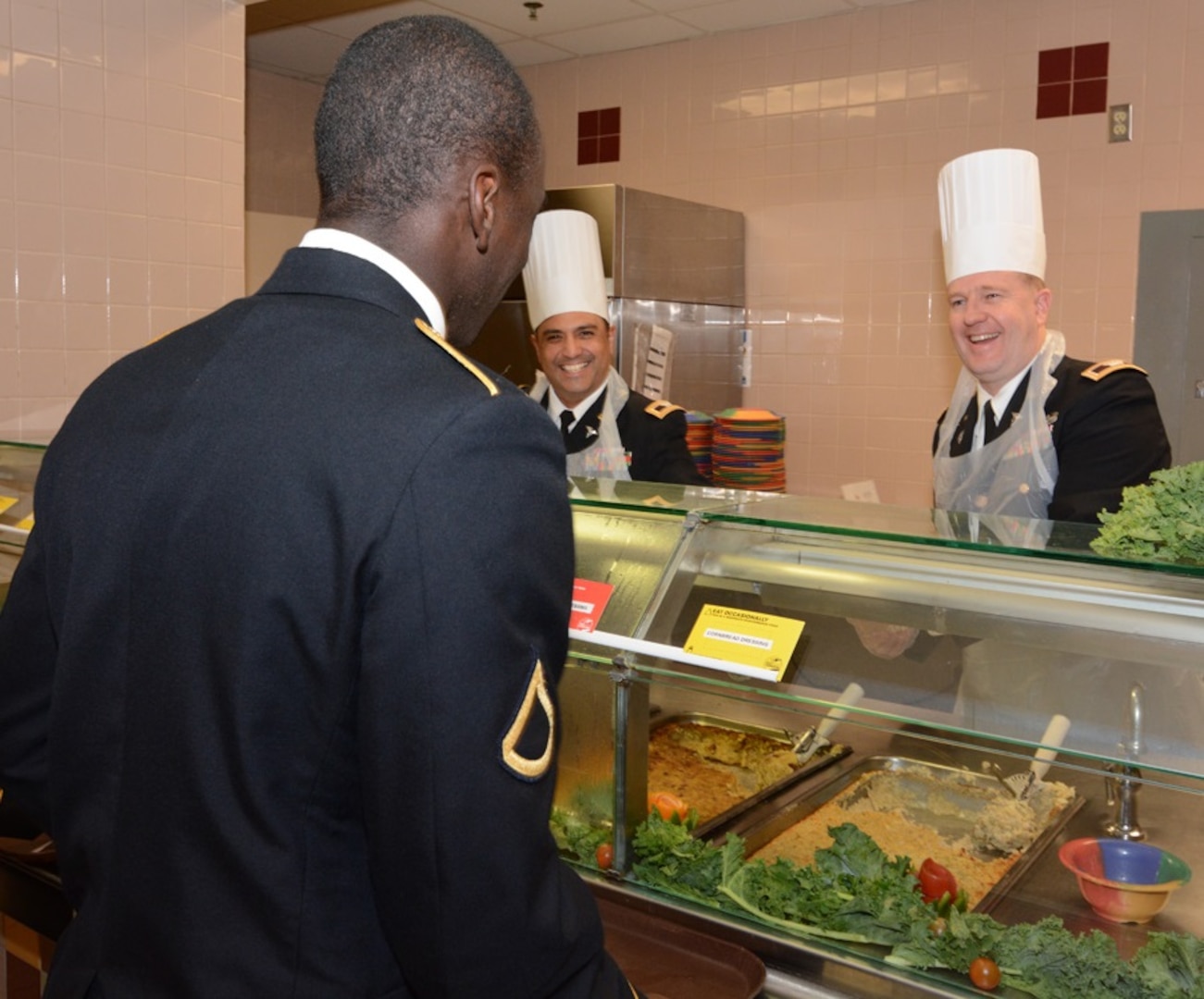 Maj. Gen. Brian C. Lein, Commanding General, Army Medical Department Center & School at Joint Base San Antonio-Fort Sam Houston, AMEDDC&S Command Sgt. Maj. Buck O'Neal and other leaders serve Thanksgiving dinner to Soldiers at the Rocco Dining Facility at JBSA-Fort Sam Houston Nov. 23.