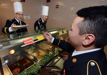 Maj. Gen. Brian C. Lein, Commanding General, Army Medical Department Center & School at Joint Base San Antonio-Fort Sam Houston, AMEDDC&S Command Sgt. Maj. Buck O'Neal and other leaders serve Thanksgiving dinner to Soldiers at the Rocco Dining Facility at JBSA-Fort Sam Houston Nov. 23.