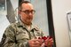 Chief Master Sgt. Jarrod Sebastian, 23d Wing command chief, reads the angels he pulled from a Christmas tree, Nov. 27, 2017, at Moody Air Force Base, Ga. Each year, community members pull ornaments from the trees located at the Base Exchange and the Freedom 1 Fitness Center with a child’s description and their desired gift, and purchase the gift to be given anonymously. (U.S. Air Force photo by Airman 1st Class Erick Requadt)