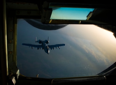 An Air Force A-10 Thunderbolt II departs after receiving fuel from a KC-135 Stratotanker
