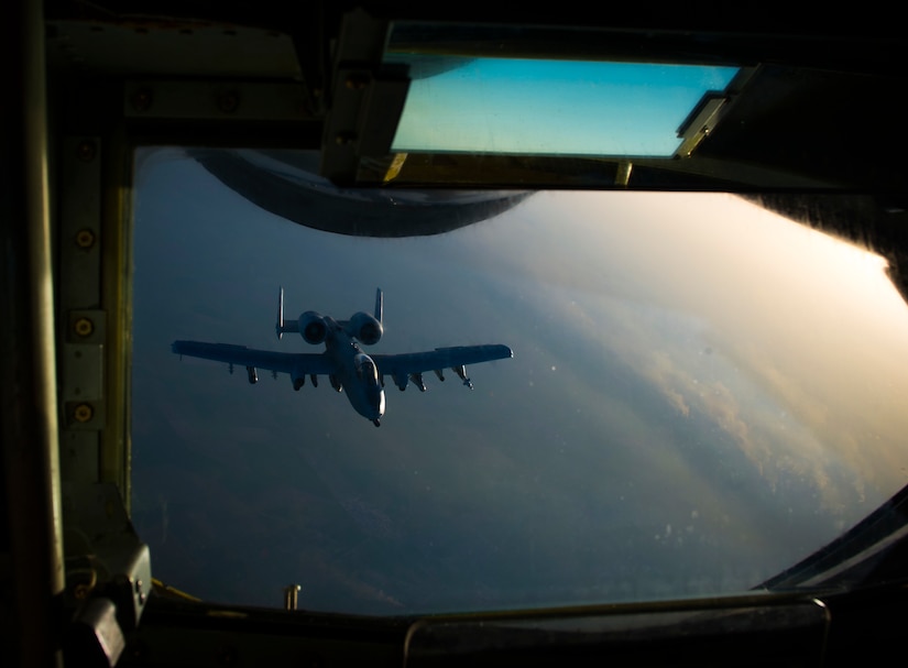 An Air Force A-10 Thunderbolt II departs after receiving fuel from a KC-135 Stratotanker