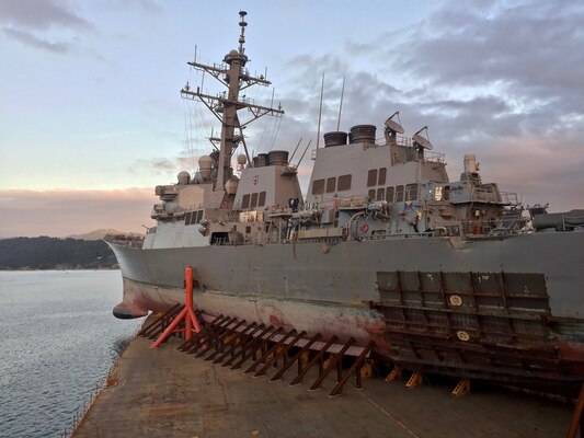 SUBIC BAY, Philippines (Nov. 28, 2017) The Arleigh Burke-class guided missile destroyer USS John S. McCain (DDG 56) departs Subic Bay, Philippines aboard heavy lift transport vessel MV Treasure, Nov. 28. Treasure will transport McCain to Fleet Activities Yokosuka to undergo repairs.