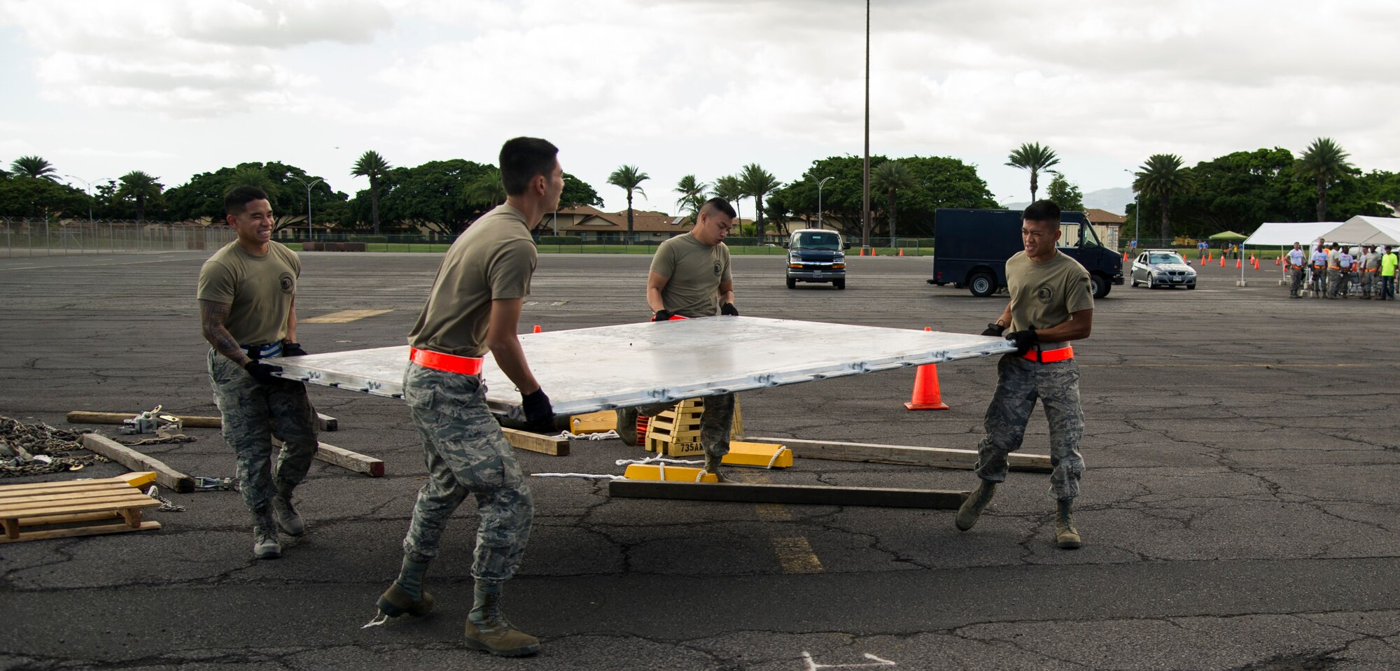 Members of the 48th Aerial Port Squadron move an aircraft pallet during a portion of the Hickam Port Dawg Challenge, at Joint Base Pearl Harbor-Hickam, Hawaii, Nov. 17, 2017.