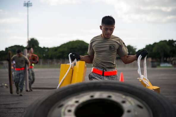 Airman 1st Class John Bonilla, 48th Aerial Port Squadron, moves equipment from one aircraft pallet to another during the combat fitness challenge portion of the Hickam Port Dawg Challenge, at Joint Base Pearl Harbor-Hickam, Hawaii, Nov. 17, 2017.