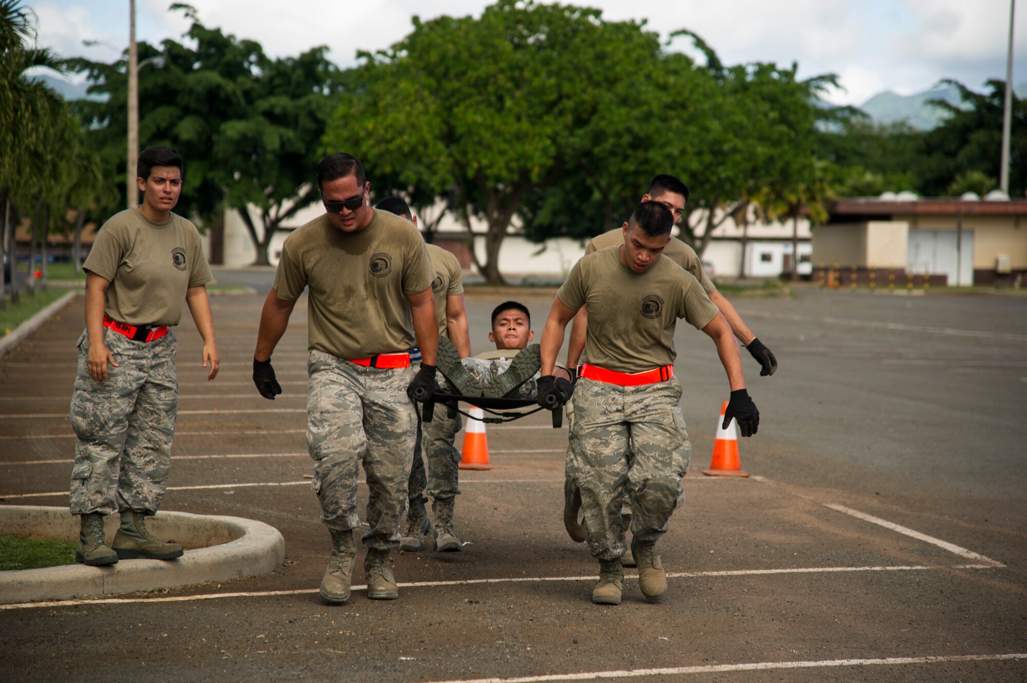 Members of the 48th Aerial Port Squadron perform a litter carry during the combat fitness challenge portion of the Hickam Port Dawg Challenge, at Joint Base Pearl Harbor-Hickam, Hawaii, Nov. 17, 2017.