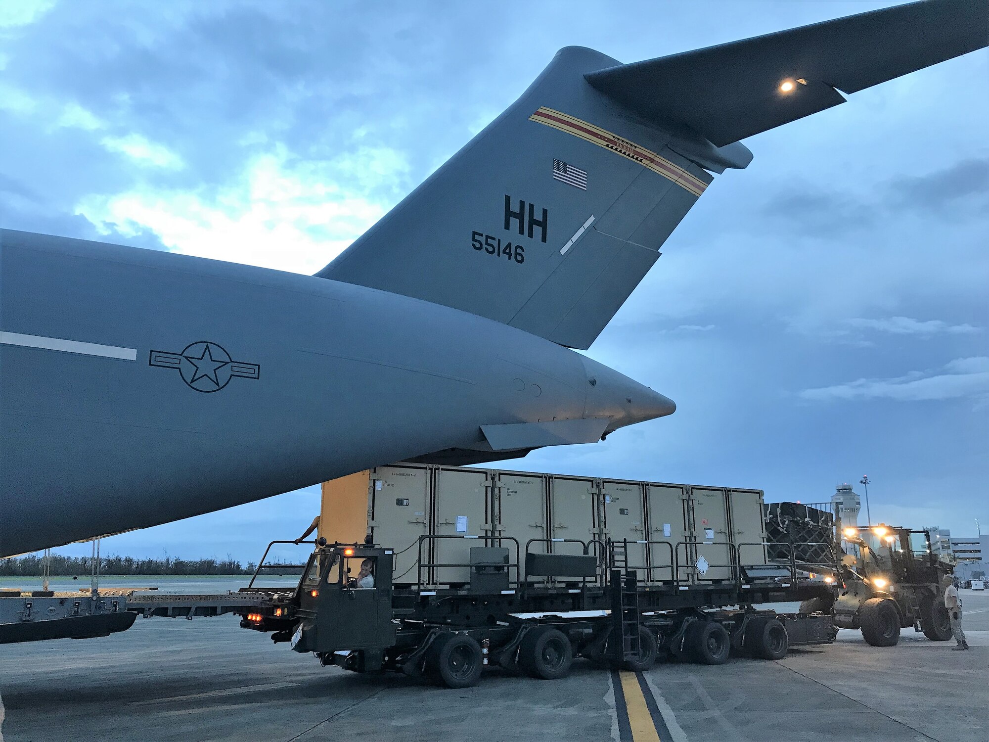 Cargo is offloaded out the back of a C-17 Globemaster III, San Juan International Airport, Oct. 8, 2017. The C-17 and crew were assigned to the Hawaii Air National Guard's 204th Airlift Squadron and were assisting with Hurricane Maria Relief efforts.