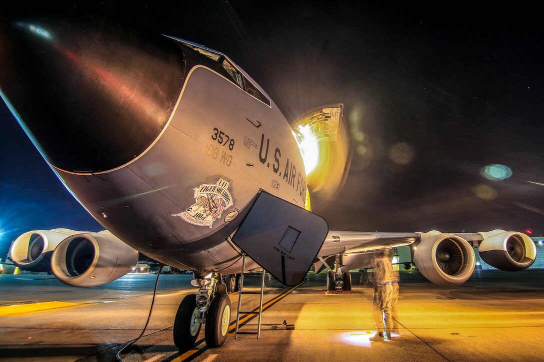 An aircraft sits on a runway.