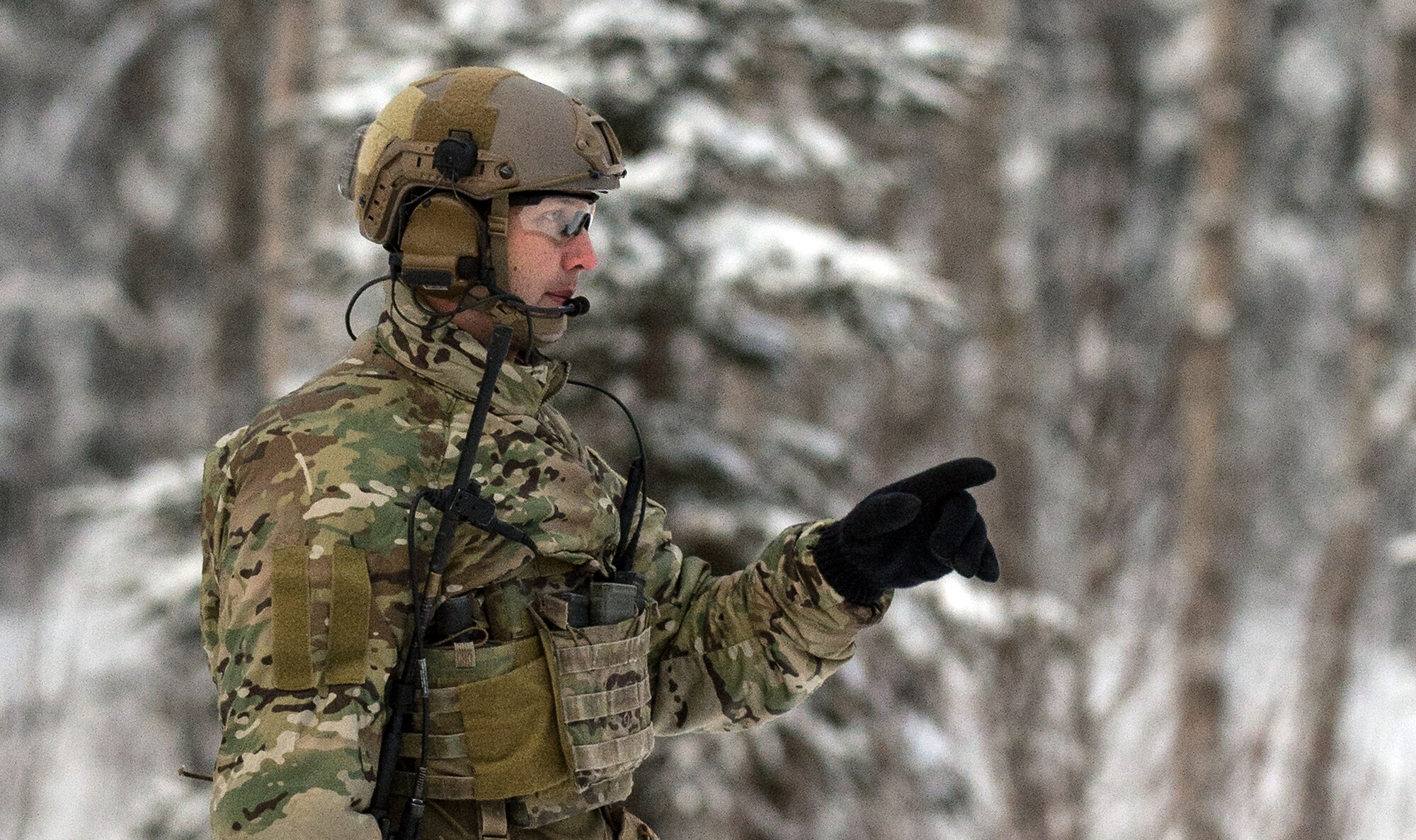 An Alaska Air National Guardsmen assigned to the 212th Rescue Squadron gives directions during a mass-casualty search-and-rescue training at Joint Base Elmendorf-Richardson, Alaska, Nov. 21, 2017. During the exercise, the rescue operators located, assessed, treated and evacuated numerous casualties while engaging and eliminating multiple attacks from opposition forces. In addition to training for combat search-and-rescue missions, the 212th Rescue Squadron also provides emergency rescue services for Alaska residents and visitors. (U.S. Air Force photo by Senior Airman Curt Beach)