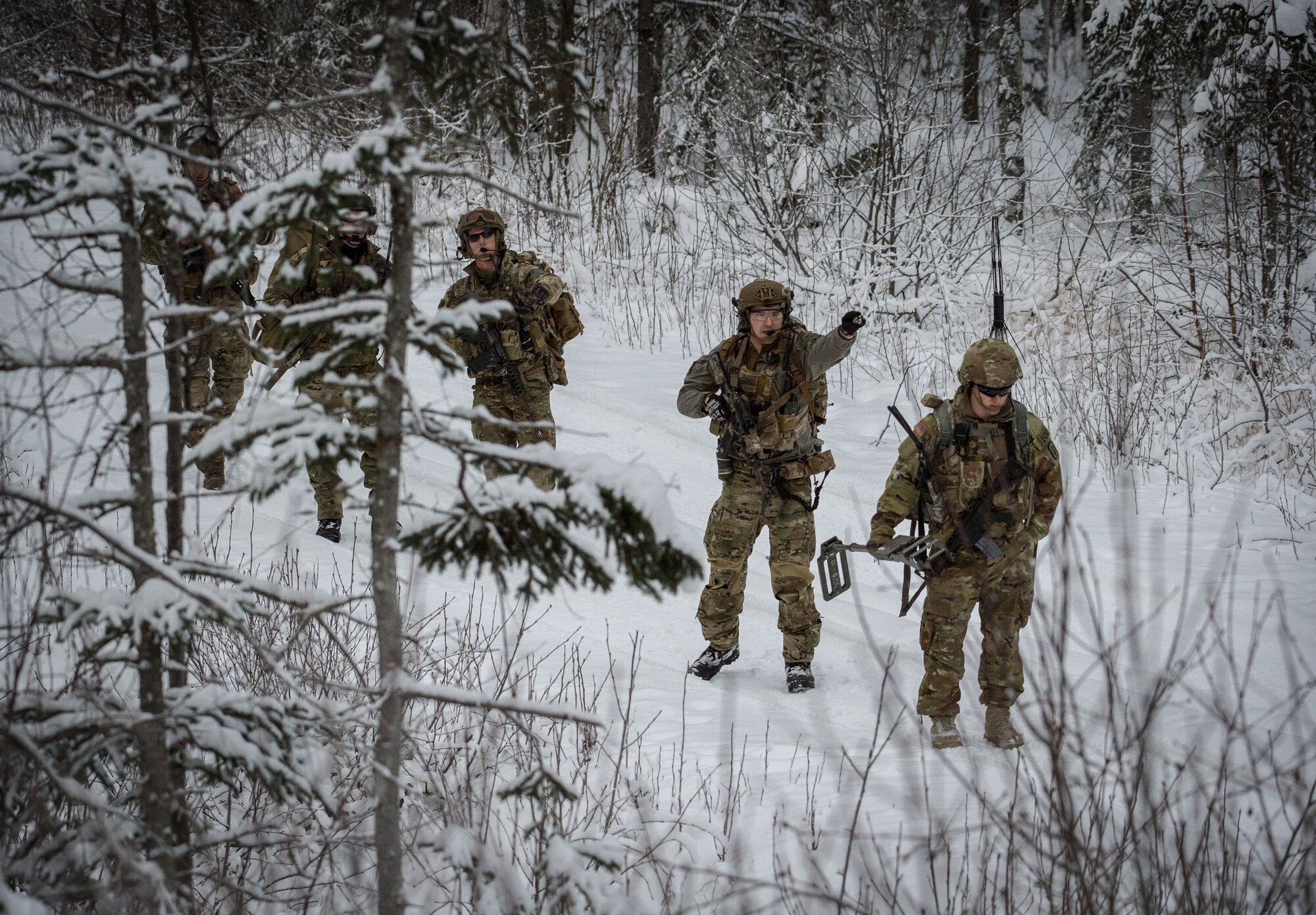 Soldiers assigned to the 716th Explosive Ordnance Disposal Company conduct mass-casualty search-and-rescue training at Joint Base Elmendorf-Richardson, Alaska, Nov. 21, 2017. During the exercise, JBER Airmen and Soldiers located, assessed, treated and evacuated numerous casualties while engaging and eliminating multiple attacks from opposition forces. (U.S. Air Force photo by Senior Airman Curt Beach)