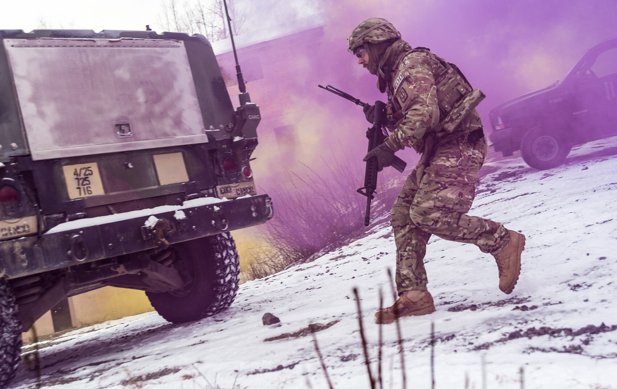 A Soldier assigned to the 716th Explosive Ordnance Disposal Company engages opposition forces while conducting mass-casualty search-and-rescue training at Joint Base Elmendorf-Richardson, Alaska, Nov. 21, 2016. During the exercise, the rescue operators located, assessed, treated and evacuated numerous casualties while engaging and eliminating multiple attacks from opposition forces. (U.S. Air Force photo by Senior Airman Curt Beach)