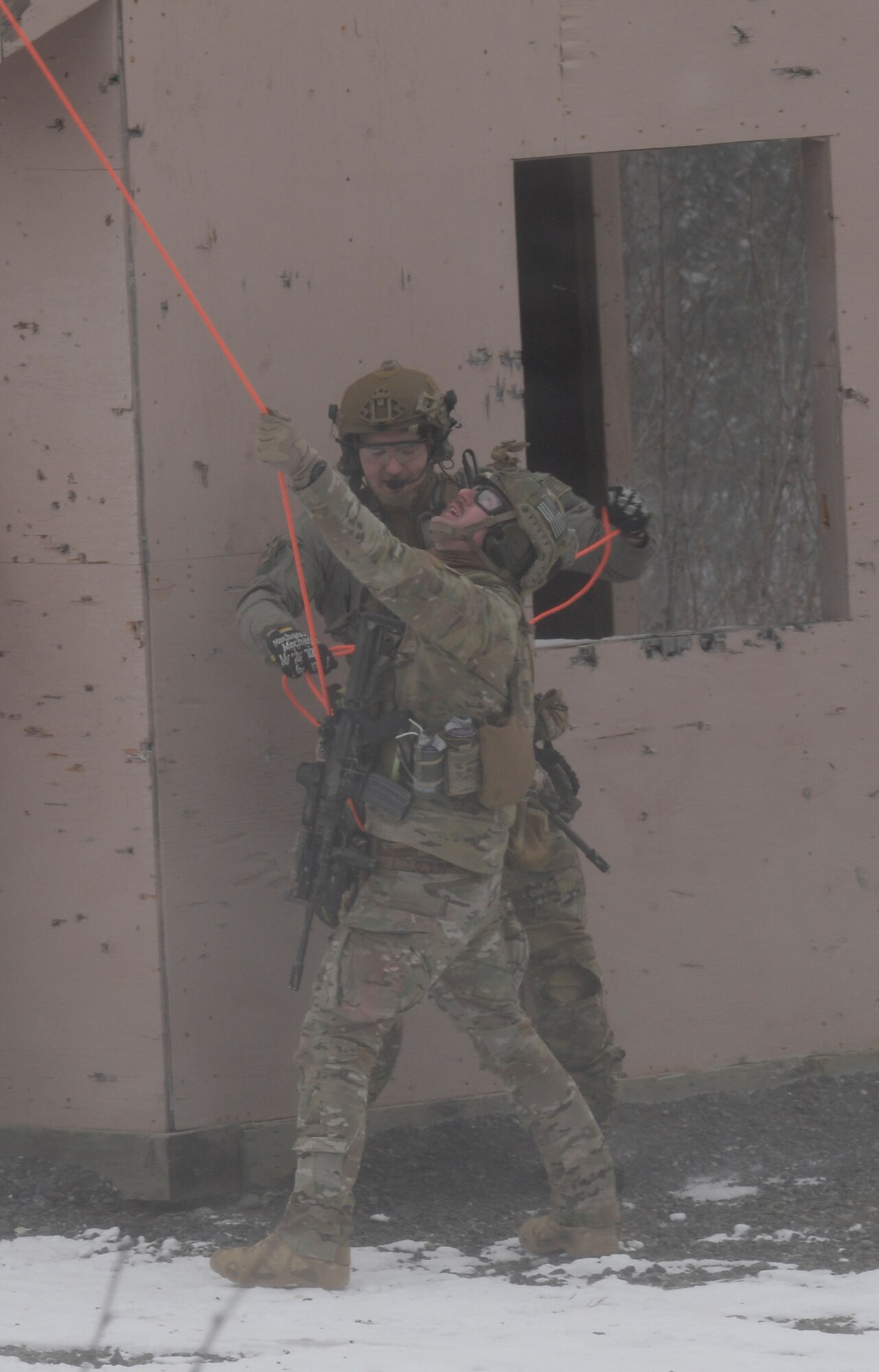 Alaska Army and Air National Guardsmen assigned to the 212th Rescue Squadron participate in a mass-casualty search-and-rescue training at Joint Base Elmendorf-Richardson, Alaska, Nov. 21, 2017. During the exercise, the rescue operators located, assessed, treated and evacuated numerous casualties while engaging and eliminating multiple attacks from opposition forces. In addition to training for combat search-and-rescue missions, the 212th Rescue Squadron also provides emergency rescue services for Alaska residents and visitors. (U.S. Air Force photo by Senior Airman Curt Beach)