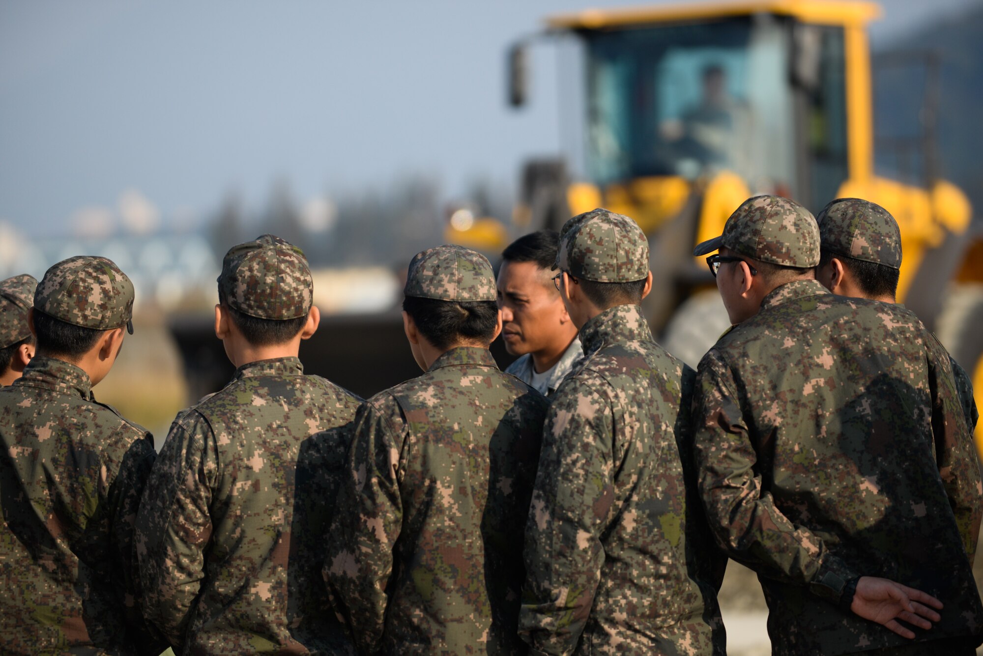 U.S. Air Force Master Sgt. Richard Loreto, Air Force Civil Engineer Center contingency instructor, explains a runway repair process to Republic of Korea Airmen during a bilateral training exercise at Gwangju Air Base, R.O.K., Nov. 6, 2017. Approximately forty U.S. Airmen from the 773d Civil Engineer Squadron at Joint Base Elmendorf-Richardson, Alaska, and 40 Republic of Korea Airmen from Gwangju trained together for a week to learn a new runway repair process for wartime contingencies. The bilateral training exercise enhanced interoperability and built partnership capacity in the Indo-Asia Pacific region. (U.S. Air Force photo by Senior Airman Curt Beach)