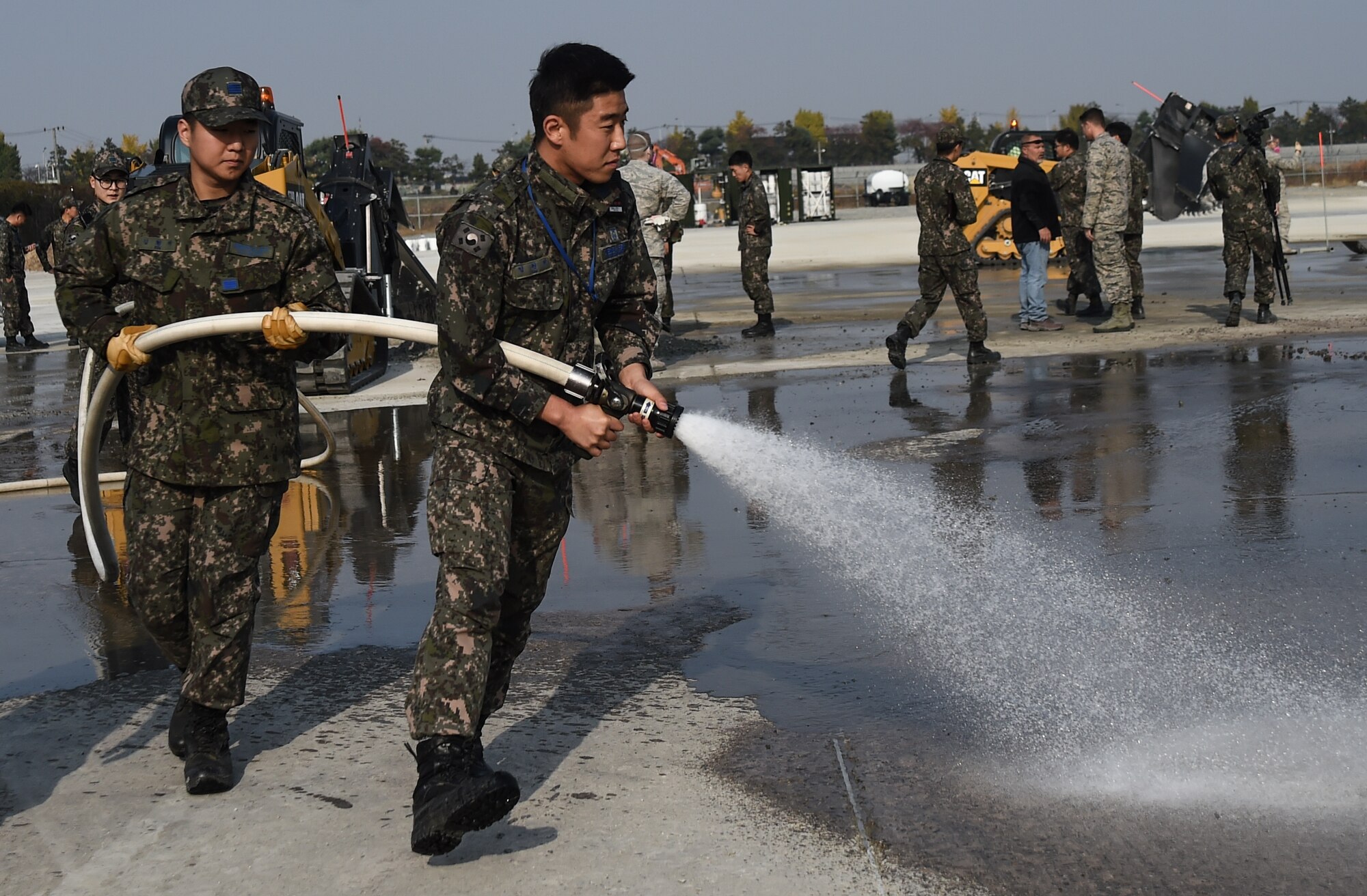Republic of Korea Air Force Airmen participate in a Rapid Airfield Damage Repair training exercise at Gwangju Air Base, R.O.K., Nov. 8, 2017. Approximately forty U.S. Airmen from the 773d Civil Engineer Squadron at Joint Base Elmendorf-Richardson, Alaska, and 40 R.O.K. Airmen from Gwangju trained together for a week to learn a new runway repair process for wartime contingencies. The bilateral training exercise enhanced interoperability and built partnership capacity in the Indo-Asia Pacific region. (U.S. Air Force photo by Senior Airman Curt Beach)