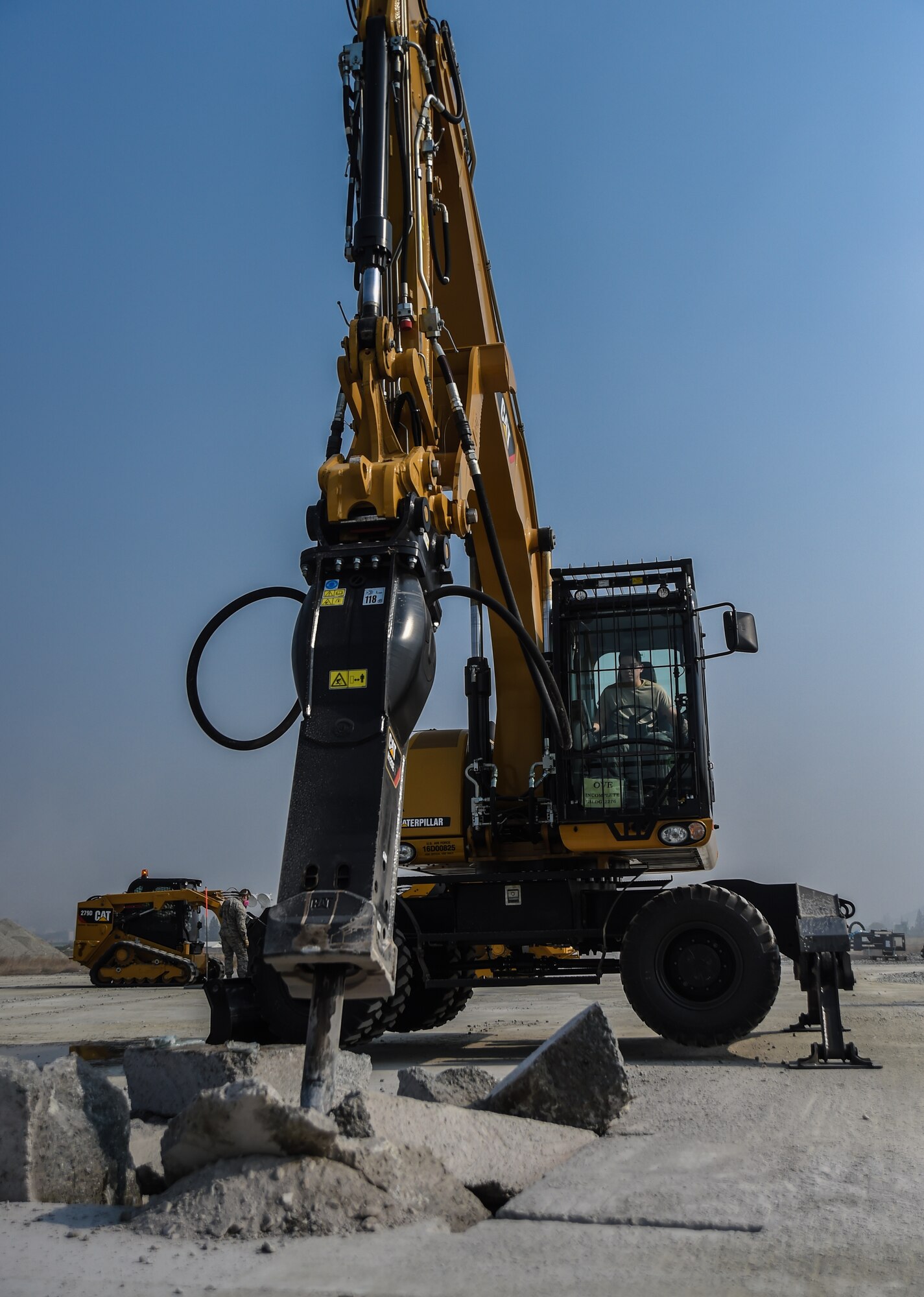 U.S. Air Force Senior Airman Cameron Pinkerton, 773d Civil Engineer Squadron, excavates a crater during a Rapid Airfield Damage Repair training exercise at Gwangju Air Base, Republic of Korea., Nov. 8, 2017. Similar to an assembly line, RADR systematically lines up civil engineer personnel and equipment to quickly repair a runway after attack. The new process makes use of rapid-setting concrete which enables vehicles to pass over it after one hour, and after two hours of cure time, it can support any aircraft. (U.S. Air Force photo by Senior Airman Curt Beach)