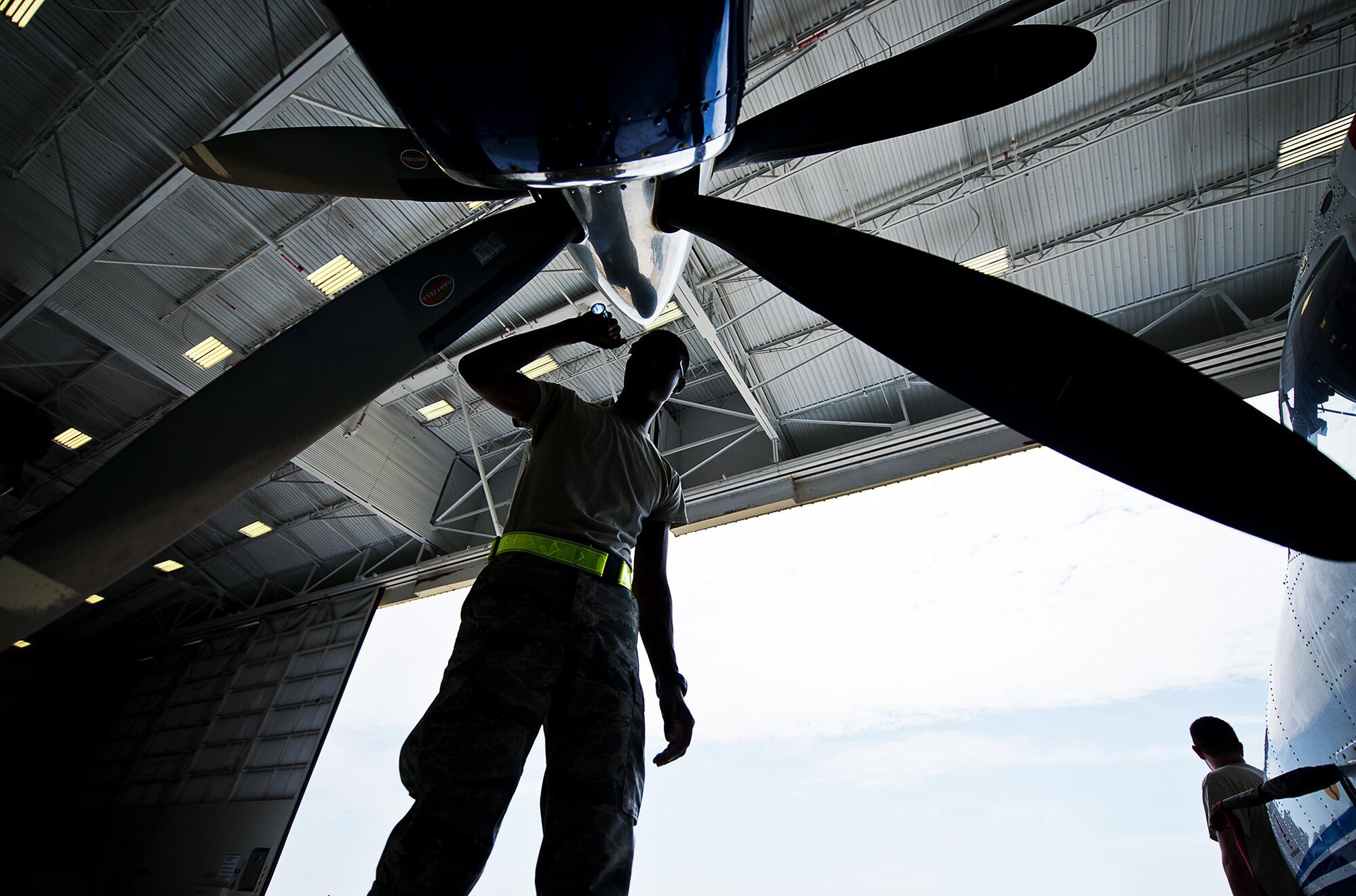 Airman Mario Hill, 919th Special Operations Maintenance Group, checks the intake of an engine on a C-145 at Duke Field, Florida. (Tech. Sgt. Sam King)