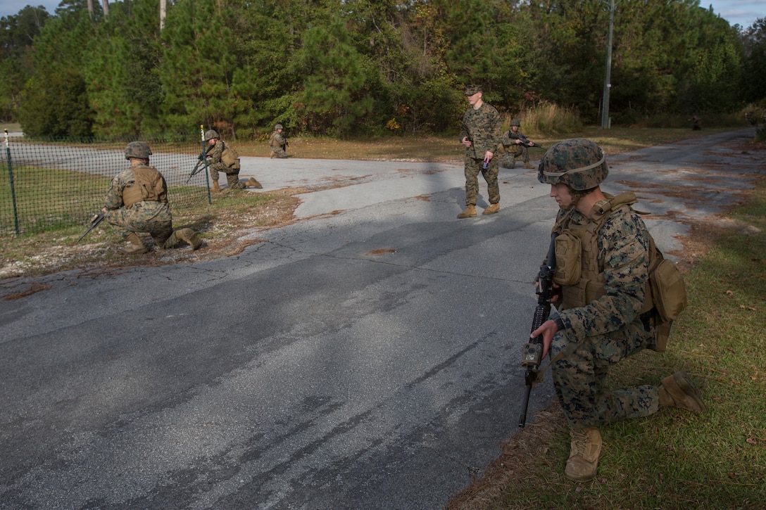 Artillery Marines with 2nd Battalion, 10th Marine Regiment set security during a training patrol as they are given instruction on patrolling fundamentals by Sgt. Timothy Buntting, an infantry squad leader with 3rd Battalion, 8th Marine Regiment, at Camp Lejeune, N.C., Nov. 14, 2017. The infantry Marines taught the artillerymen advanced patrolling tactics in preparation for their upcoming deployment. (U.S. Marine Corps photo by Lance Cpl. Ashley McLaughlin)