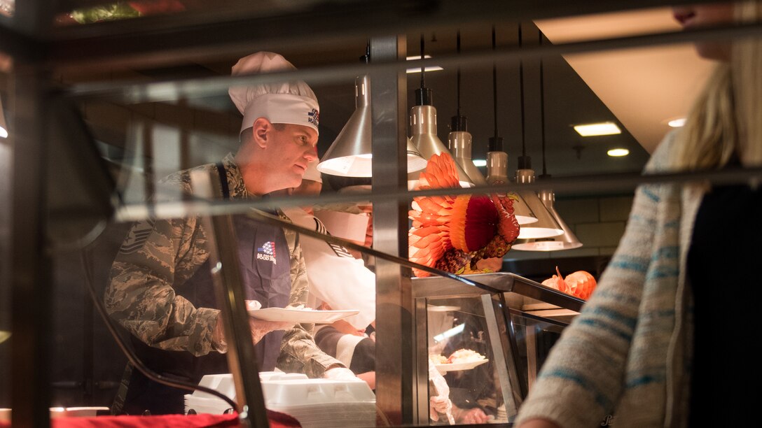 U.S. Air Force Chief Master Sgt. Derek Crowder, serves Thanksgiving lunch at the Crossbow Dining Facility on Joint Base Langley-Eustis, Va., Nov. 23, 2017.