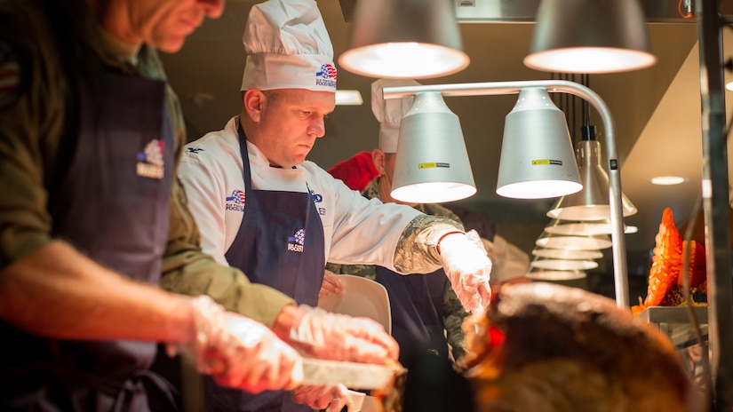 U.S. Air Force Col. Sean Tyler, 633rd Air Base Wing commander, serves Thanksgiving lunch at the Crossbow Dining Facility on Joint Base Langley-Eustis, Va., Nov. 23, 2017.