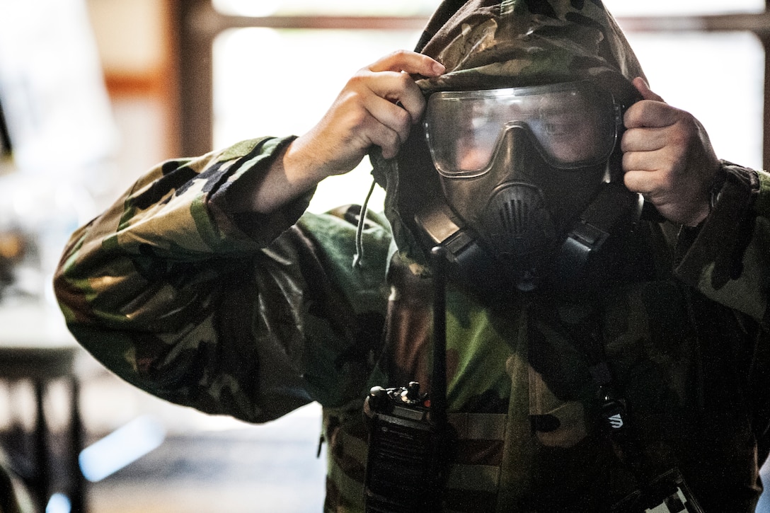 Airman tries on protective gear.