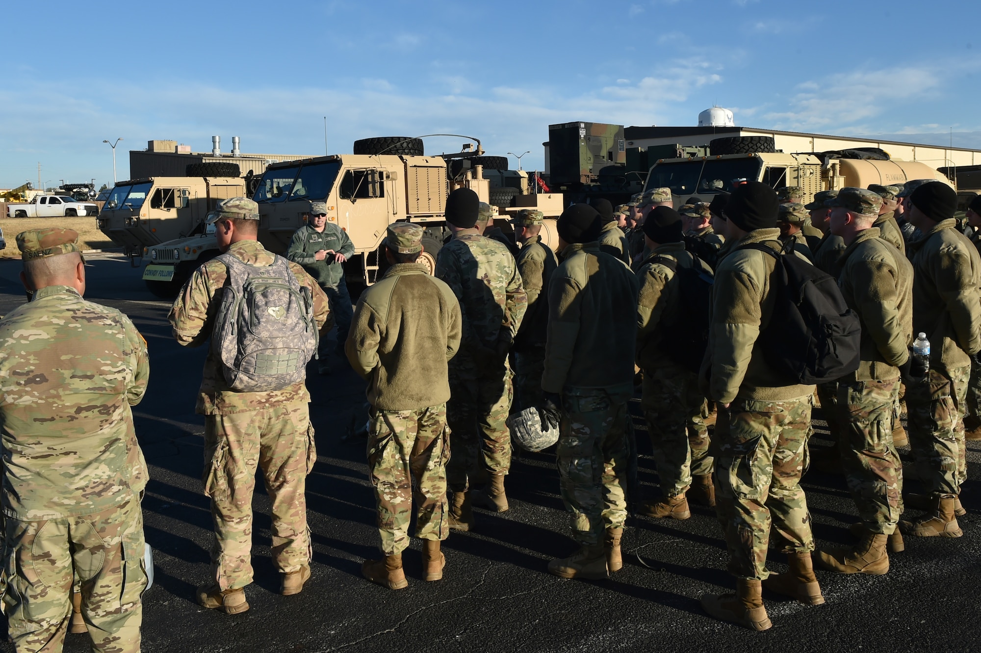 U.S. Air Force Master Sgt. Tracy Tinsley, the superintendent of air freight assigned to the 97th Logistics Readiness Squadron, talks to U.S. Army Soldiers assigned to the 4th Battalion, 3rd Air Defense Artillery Regiment about the plans for a joint exercise,