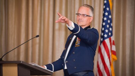 Retired Col. Michael Harasimowicz deliver his speech during the 91st Cyberspace Operations Squadron centennial celebration in San Antonio, Oct. 28, 2017. Members of the 91st COS gathered during a formal dining out event to celebrate the squadron’s anniversary, and enjoy fine food and company. (Courtesy photo)