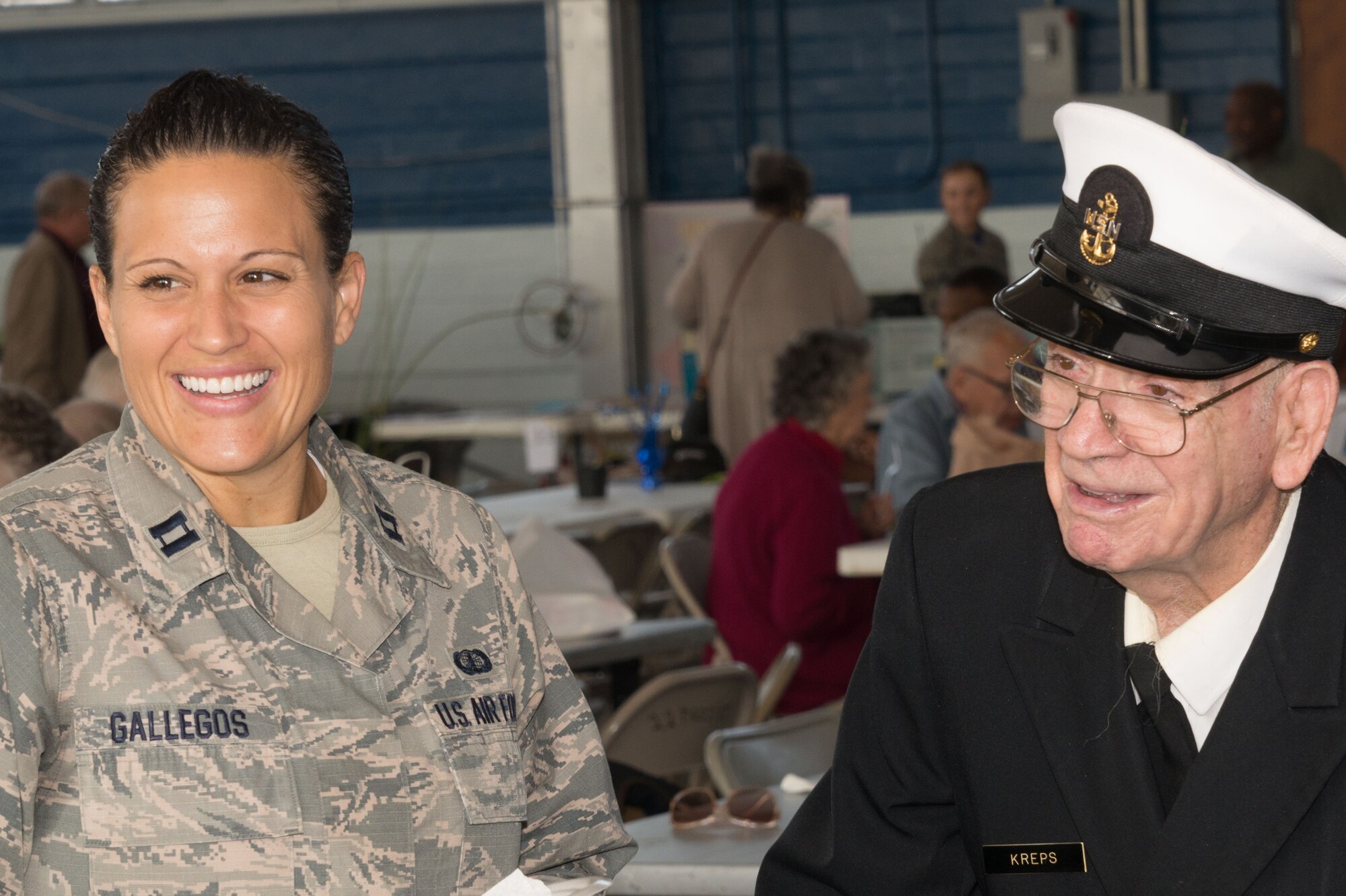 Captain Andrea Gallegos, with the Jeanne M. Holm Center for Officer Accessions and Citizen Development, shares a laugh with a veteran at last year’s Military Retiree Appreciation Day event on Maxwell. This year’s RAD is scheduled for Dec. 7, 10 a.m-2 p.m. at the Maxwell Honor Guard Hangar. (US Air Force photo by Trey Ward)