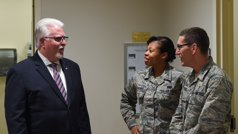 U.S. Air Force members assigned to the 633rd Medical Group speak to a Toshiba Medical executive about the new magnetic resonance imaging unit at Joint Base Langley-Eustis, Va., Nov. 20, 2017.