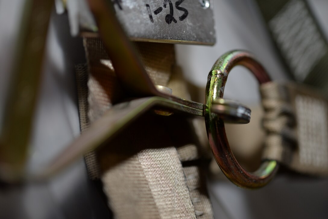 A clasp secures cargo straps on a pallet of individual protective equipment during a Civil Reserve Air Fleet readiness exercise Nov. 13, 2017, inside the IPE warehouse on Dover air Force Base, Del. CRAF aircraft and aircrews augment Air Mobility Command’s global reach, flying a large percentage of routine cargo and passengers around the world. (U.S. Air Force photo by Staff Sgt. Aaron J. Jenne)