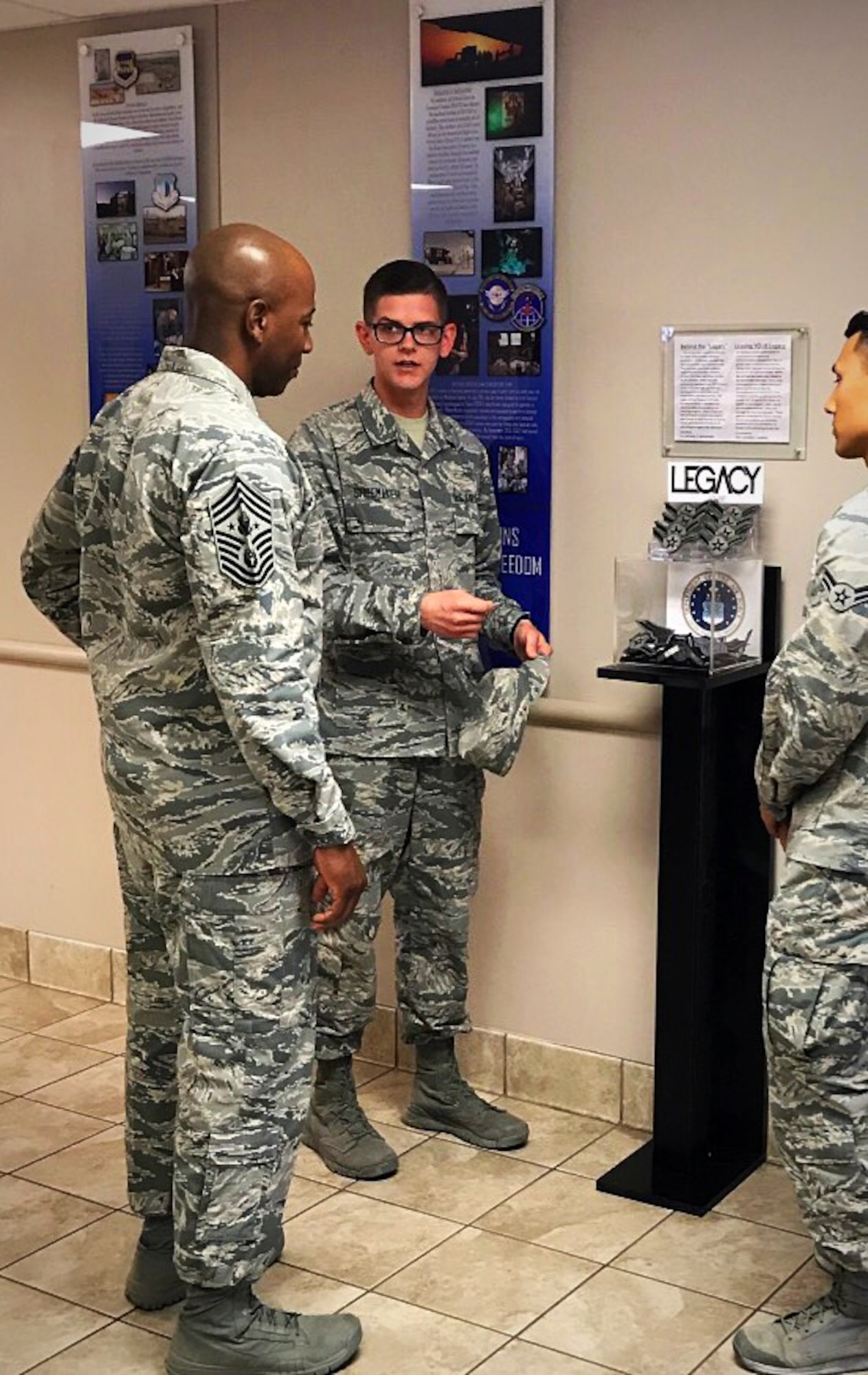 Chief Master Sgt. of the Air Force Kaleth O. Wright meets with Airman 1st Class Michael Shoemaker and Airman 1st Class Anthony Robbins, founder and cofounder of the Legacy Stripes Program, Aug. 4, 2017, at Joint Base San Antonio-Fort Sam Houston, Texas. To honor the legacy that service members create, Shoemaker and Robbins while still in technical training, saw an opportunity to encourage the donation of more than 1,000 sought-after stripes within a six-month period.