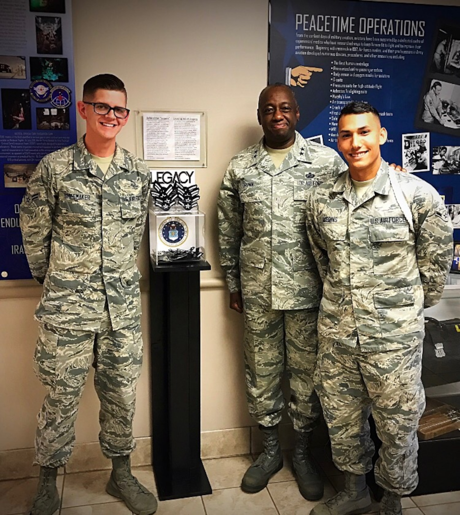 U.S. Air Force Maj. Gen. Mark Brown, deputy commander of Air Education and Training Command, stands with Airman 1st Class Michael Shoemaker and Airman 1st Class Anthony Robbins, founder and cofounder of the Legacy Stripes Program, June 13, 2017, at Joint Base San Antonio-Fort Sam Houston, Texas. To honor the legacy that service members create, Shoemaker and Robbins while still in technical training, saw an opportunity to encourage the donation of more than 1,000 sought-after stripes within a six-month period.