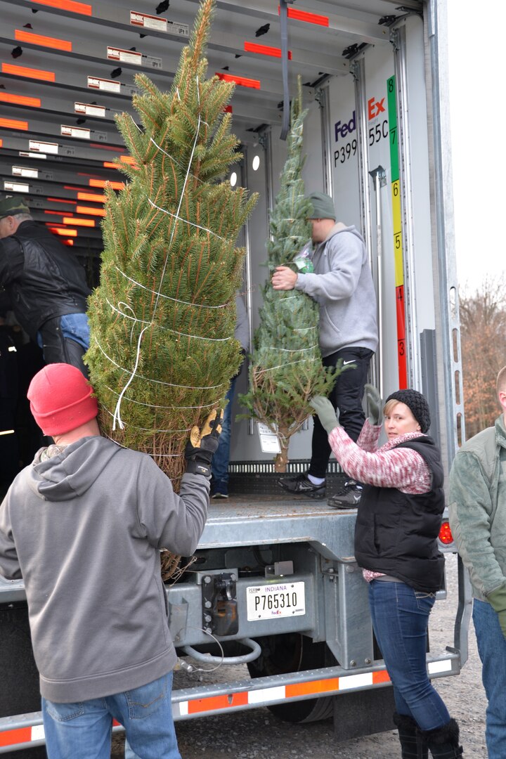 New York Guard helps load Christmas Trees for military families