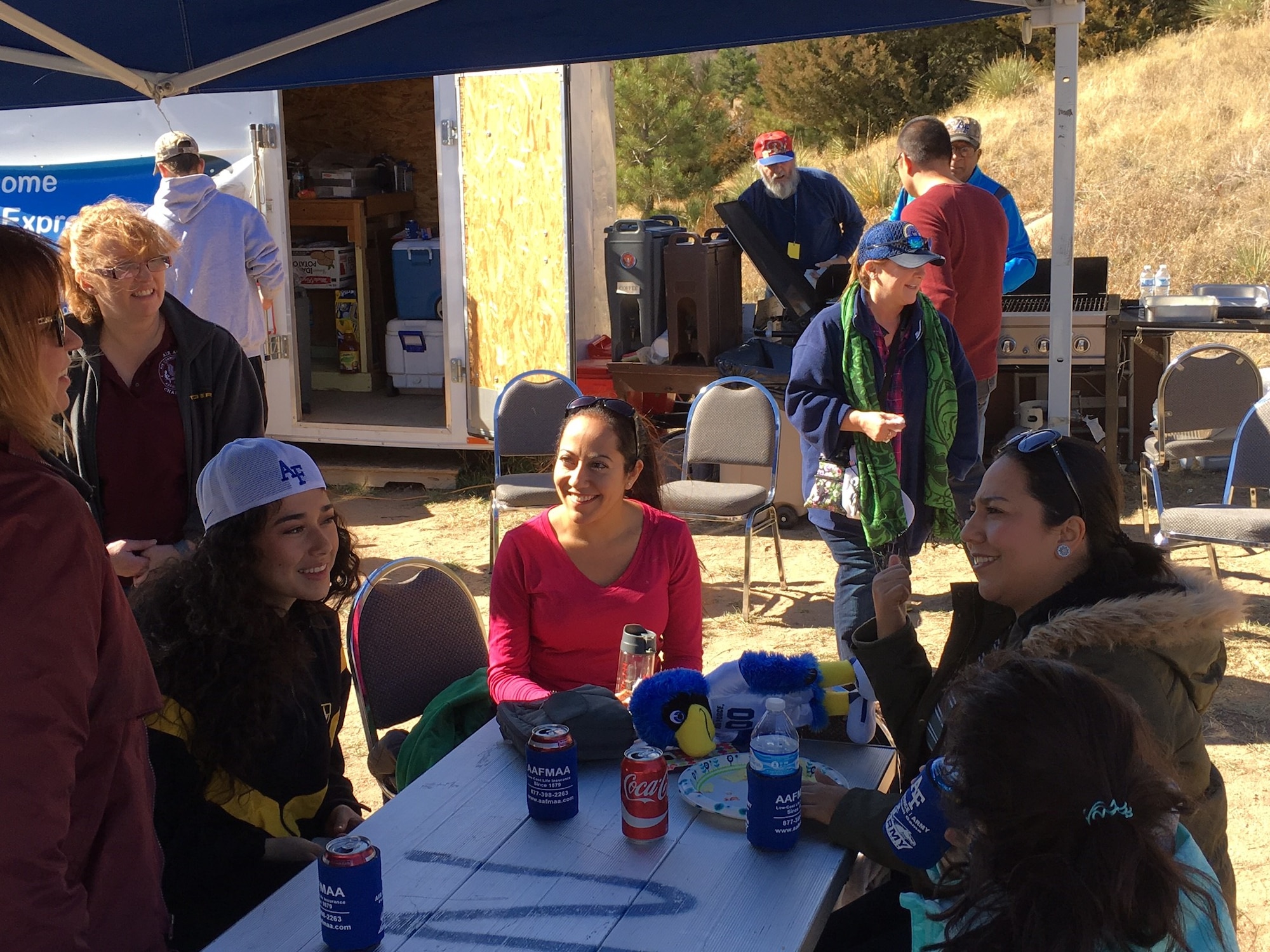 U.S. AIR FORCE ACADEMY, Colo. – Laura Benton, center, and family enjoy a Snowball tailgate event held by the local Non Commissioned Officers Association at the U.S. Air Force Academy vs. Army football game Nov. 4, 2017 at the U.S. Air Force Academy, Colorado. 
Benton and other families who had loved ones die while on active duty are hosted in these events, leading up to the national Snowball Express event held in Texas each year. All Snowball events aim to let families, especially children, know they are not forgotten and to connect them with families in similar situations to now they are not alone.
(U.S. Air Force photo by Dave Smith)