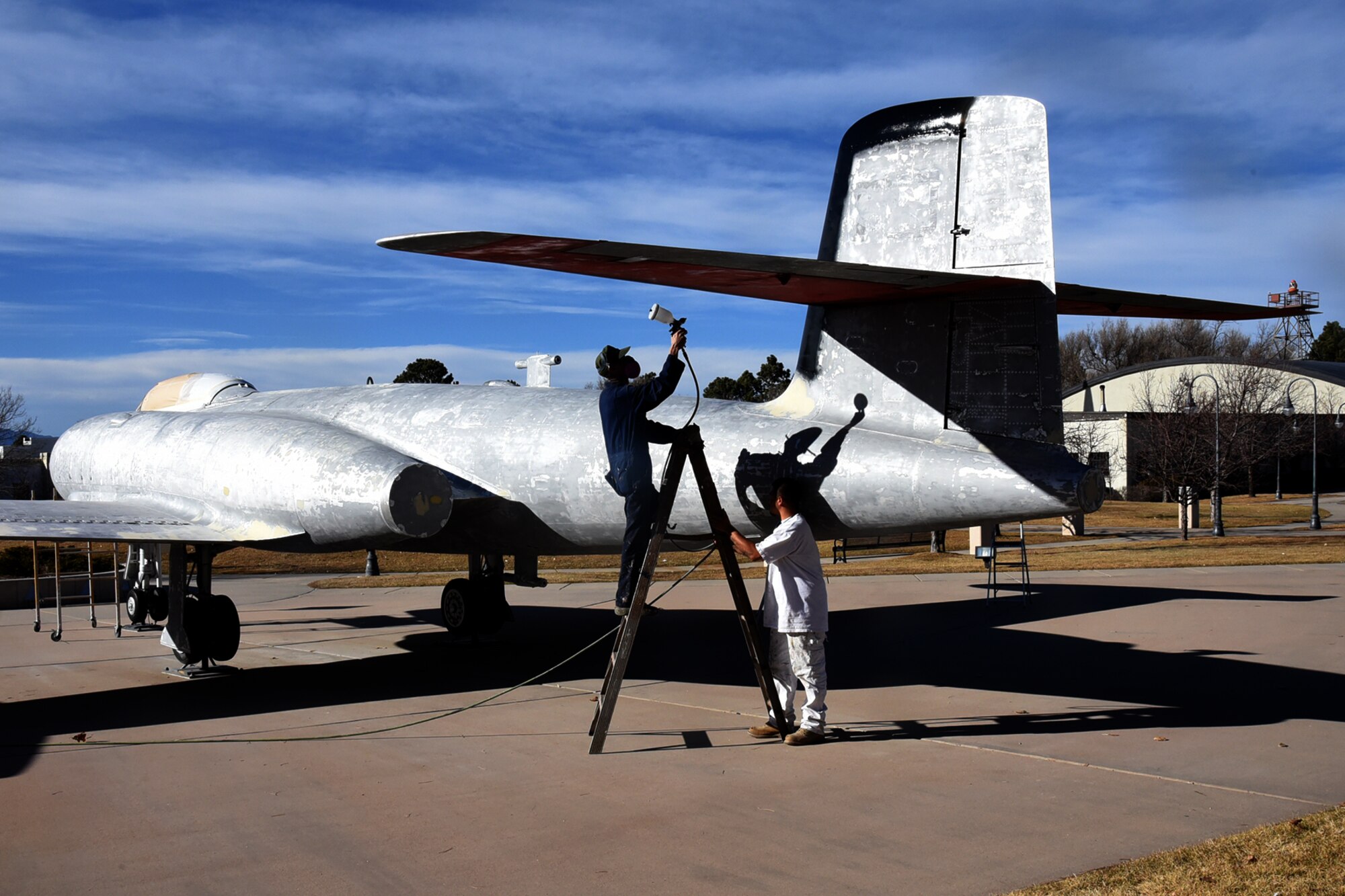 PETERSON AIR FORCE BASE, Colo. – Painters work to restore the condition of a Canadian AVRO CF-100 Mark 5C all-weather jet fighter at the 21st Space Wing, Peterson Air and Space Museum on Peterson Air Force Base, Colorado, Nov. 27, 2017. The aircraft was presented to the Peterson AFB museum in May of 1976 to commemorate the U.S. Bicentennial. It was badly damaged during the sixth-worst hail storm in Colorado history in July 2016. (U.S. Air Force photo by Robb Lingley)