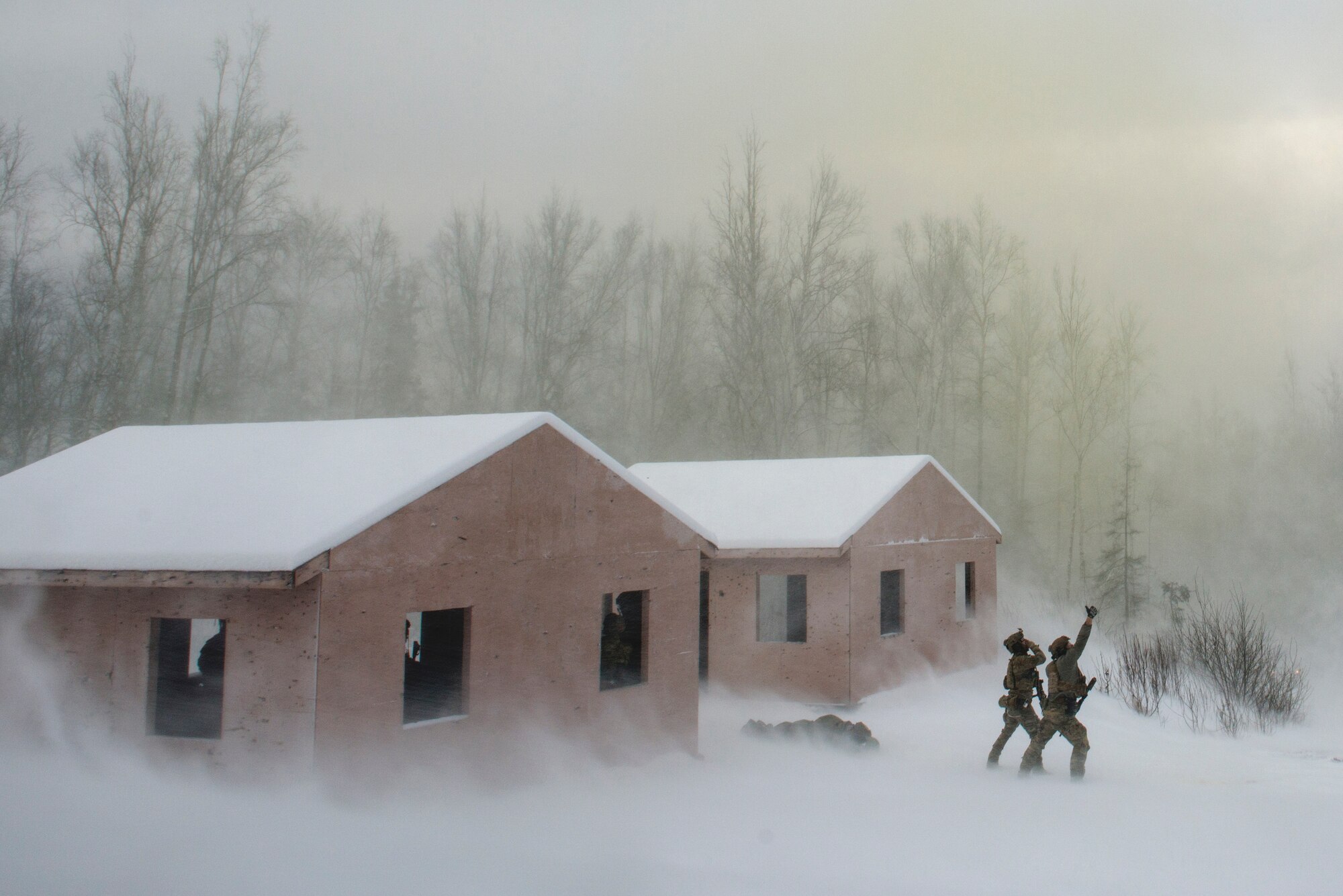 Alaska Air National Guard pararescuemen with the 212th Rescue Squadron communicate with an incoming UH-60 Black Hawk helicopter during a mass-casualty training event at Joint Base Elmendorf-Richardson, Alaska, Nov. 21, 2017.