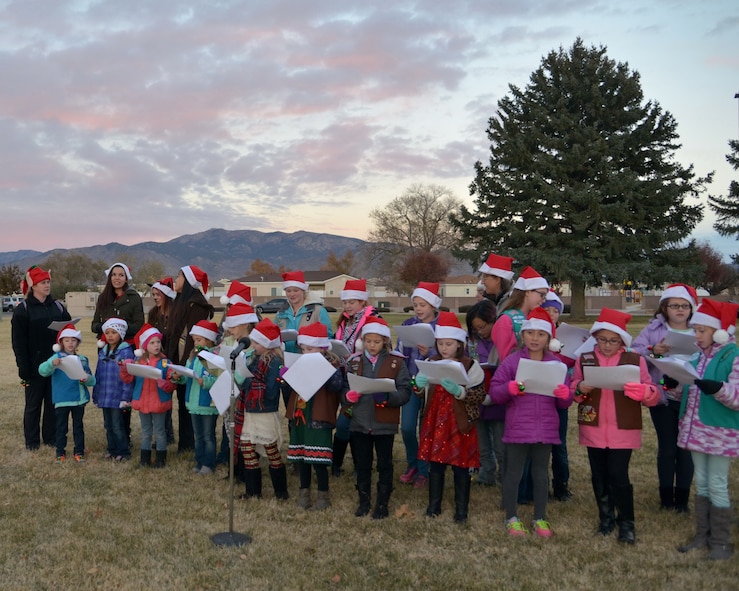 Girl Scouts sang holiday carols at last year's annual base tree lighting ceremony. This year's tree lighting is set for 4:45 p.m. Nov. 30 in the grassy area east of the chapel on D Street.  In addition to carols, there will be cookies and hot chocolate and a chance for the kids to meet Santa Claus.