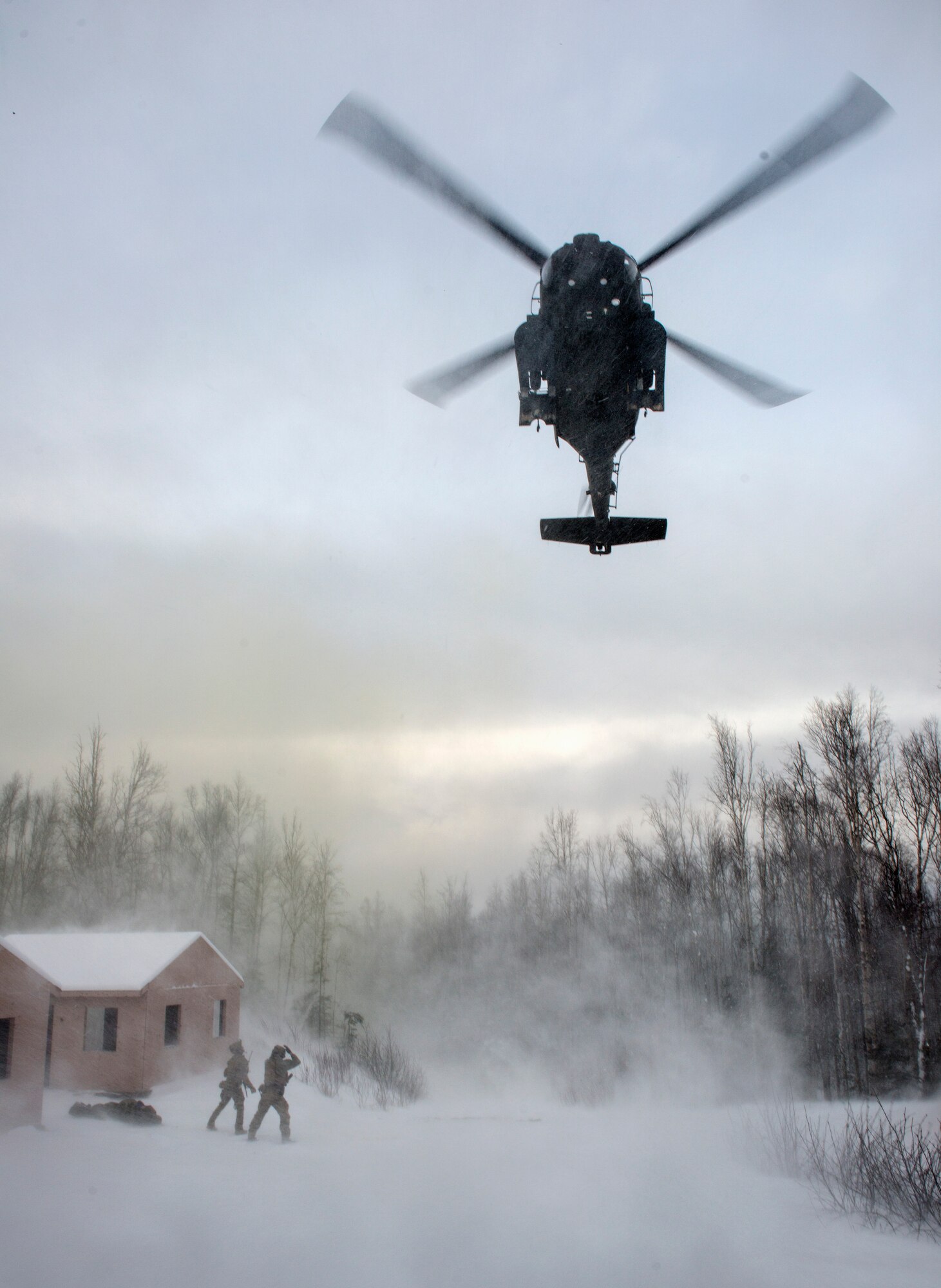 Alaska Air National Guard pararescuemen with the 212th Rescue Squadron communicate with an incoming UH-60 Black Hawk helicopter during a mass-casualty training event at Joint Base Elmendorf-Richardson, Alaska, Nov. 21, 2017.