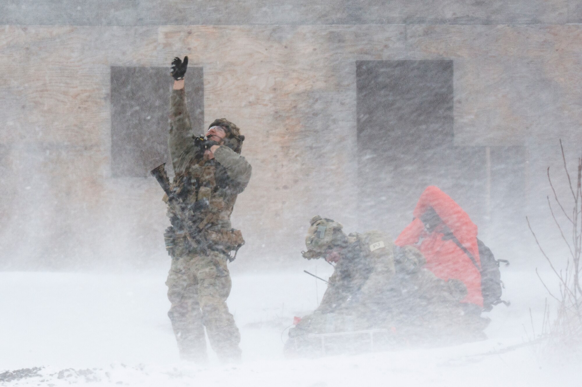 Alaska Air National Guard pararescuemen with the 212th Rescue Squadron communicate with an incoming UH-60 Black Hawk helicopter during a mass-casualty training event at Joint Base Elmendorf-Richardson, Alaska, Nov. 21, 2017.