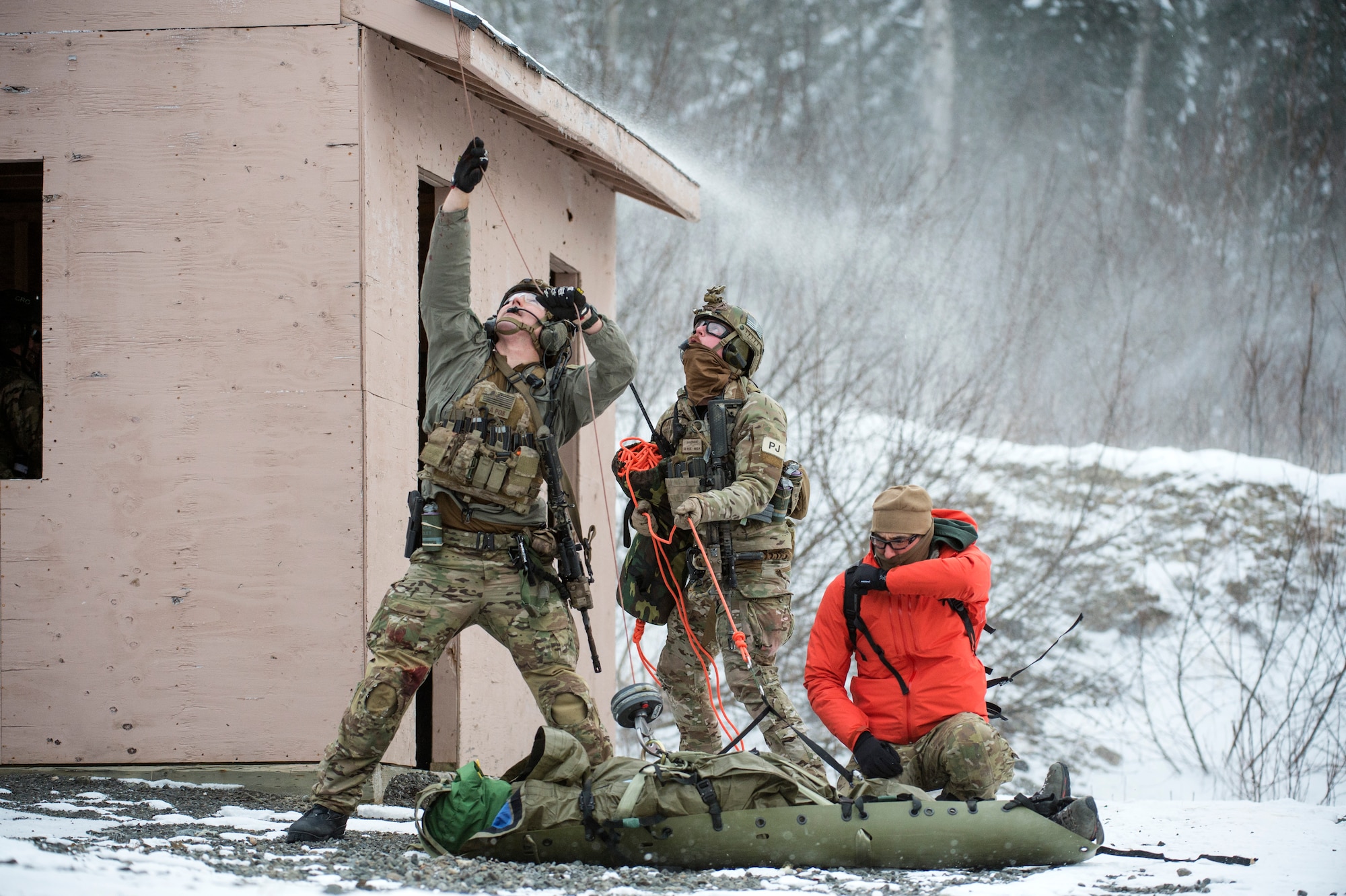 An Alaska Air National Guard pararescueman with the 212th Rescue Squadron reloads his M4 carbine while participating in a mass-casualty training event at Joint Base Elmendorf-Richardson, Alaska, Nov. 21, 2017.