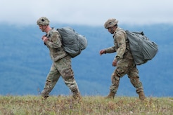 Paratroopers assigned to the 1st Battalion, 501st Parachute Infantry Regiment 4th Infantry Brigade Combat Team (Airborne), 25th Infantry Division, U.S. Army Alaska, proceed to the rally point after conducting airborne jump training at Malemute drop zone, Joint Base Elmendorf-Richardson, Alaska, Aug. 24, 2017.