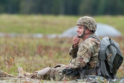 Sgt. Benjamin Farrier, a paratrooper assigned to Bravo Battery, 2nd Battalion, 377th Parachute Field Artillery Regiment, 4th Infantry Brigade Combat Team (Airborne), 25th Infantry Division, U.S. Army Alaska, smiles after completing airborne jump training at Malemute drop zone, Joint Base Elmendorf-Richardson, Alaska, Aug. 24, 2017.