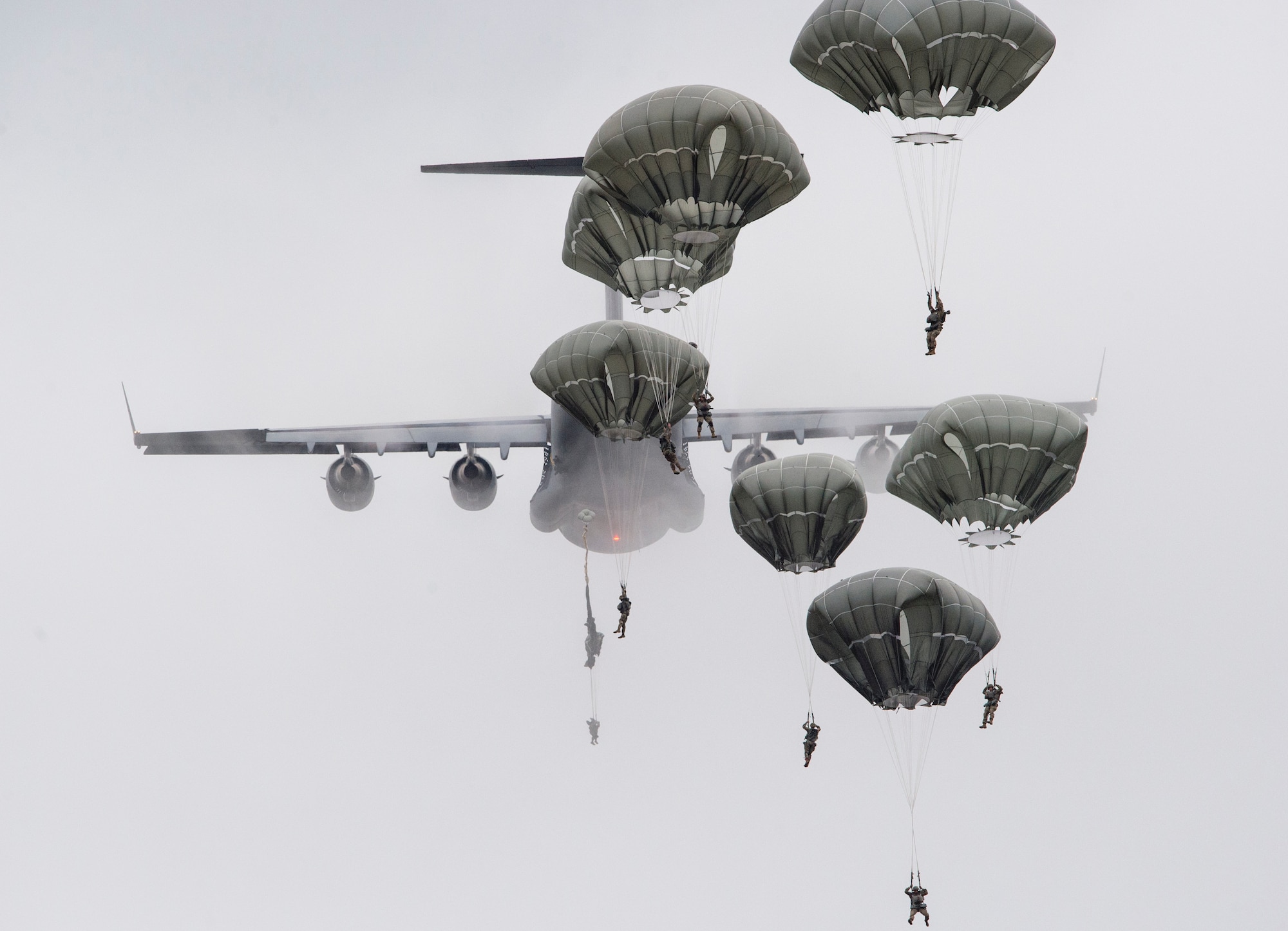 Paratroopers assigned to the 4th Infantry Brigade Combat Team (Airborne), 25th Infantry Division, U.S. Army Alaska, descend after jumping from a C-17 Globemaster III out of Joint Base Charleston, while conducting airborne training over Malemute drop zone, Joint Base Elmendorf-Richardson, Alaska, Aug. 24, 2017.