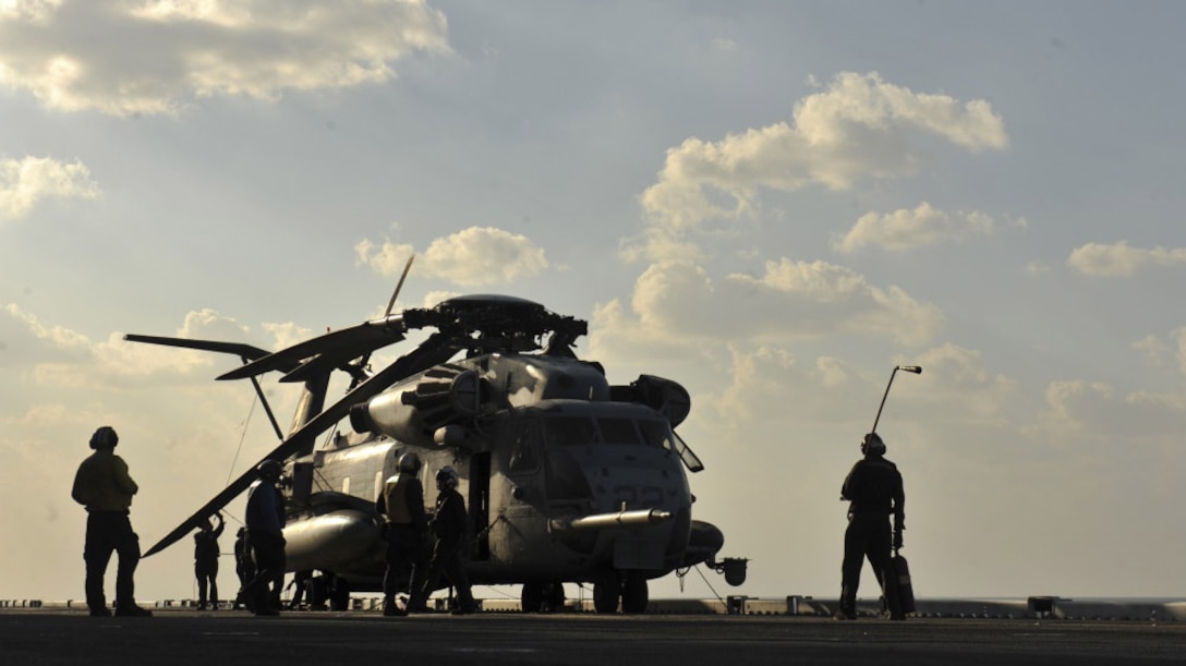 A CH-53E Super Stallion assigned to Marine Medium Tiltrotor Squadron 161 with the 15th Marine Expeditionary Unit sits on the flightdeck of amphibious assault ship USS America. The CH-53E is the Marine Corps’ primary heavy-lift helicopter and supports the Marine Air-Ground Task Force commander by providing assault support transport of heavy equipment, combat troops, and supplies, day or night under all weather conditions during expeditionary, joint or combined operations. The 15th MEU is embarked with the America Amphibious Ready Group and is deployed to maintain regional security in the U.S. 5th Fleet area of operations.