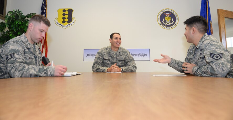Chaplain 1st Lt. Raidel Leon-Martinez, a chaplain assigned to the 28th Bomb Wing, meets with chapel staff members about upcoming events at Ellsworth Air Force Base, S.D., Nov. 21, 2017. Leon-Martinez relies on chaplain assistants to provide him with opportunities for Airmen engagement. (U.S. Air Force photo by Airman 1st Class Thomas Karol)